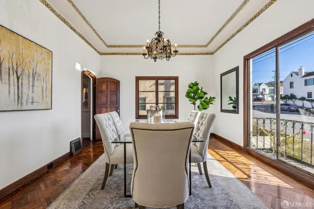 a view of a dining room with furniture window and wooden floor