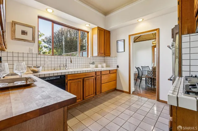 a kitchen with a sink and a window