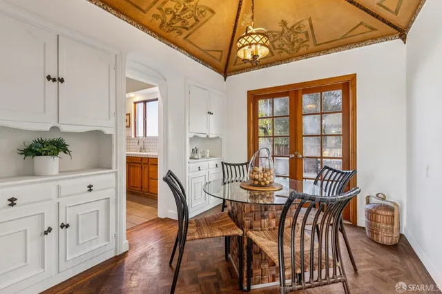 a dining room with furniture and window