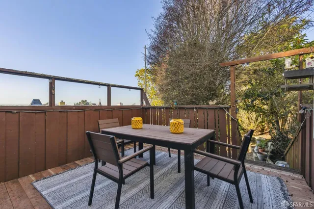 a bedroom with furniture and a wooden floor