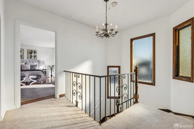 a bedroom with a large bed and a couch