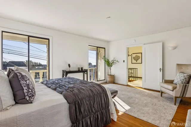 a bathroom with a sink a potted plant and mirror