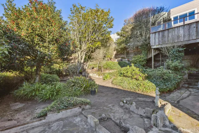 an aerial view of residential building with parking