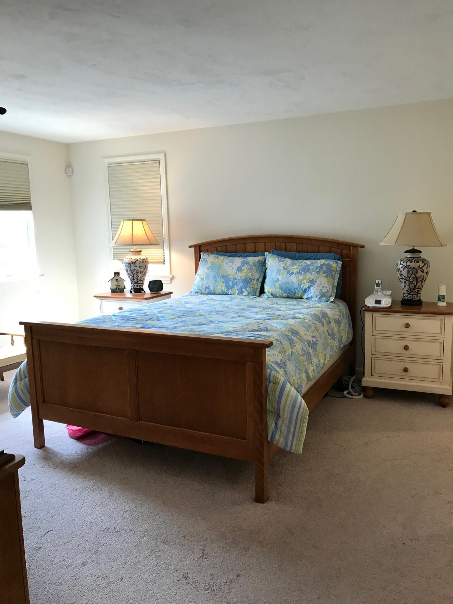 1 North Ridge Road Mashpee, MA 02649 - Photo 17 of 34 a bedroom with a bed and a dresser