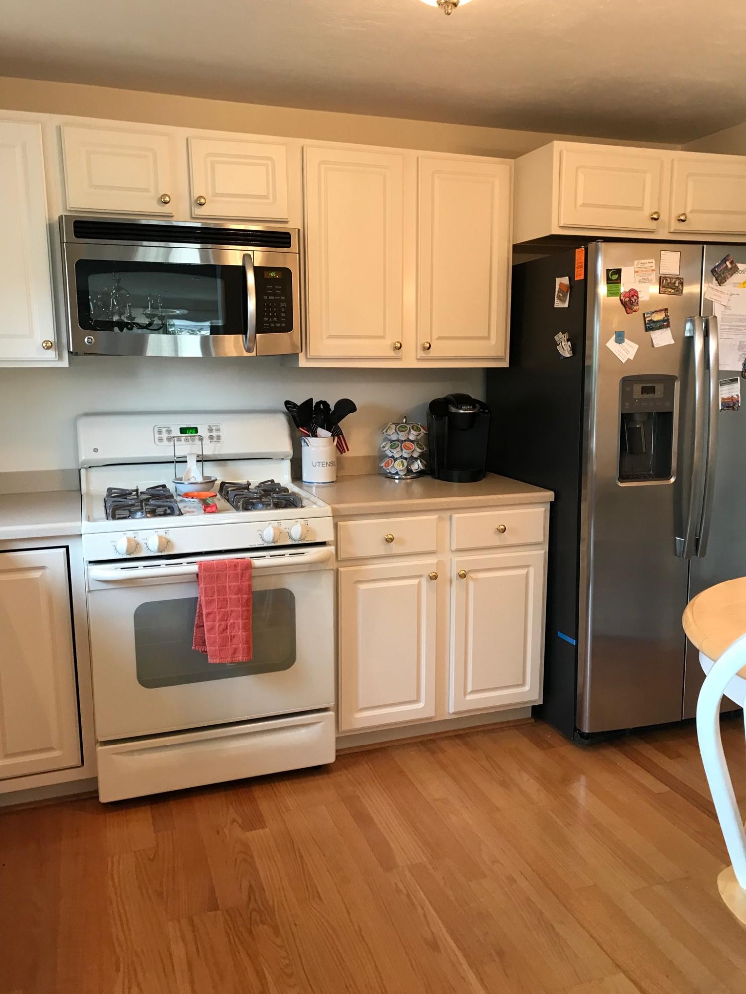 1 North Ridge Road Mashpee, MA 02649 - Photo 3 of 34 a kitchen with stainless steel appliances a stove a microwave and a sink