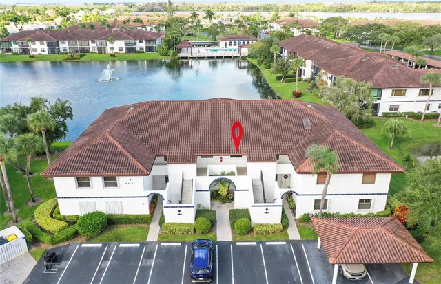 an aerial view of a house with outdoor space