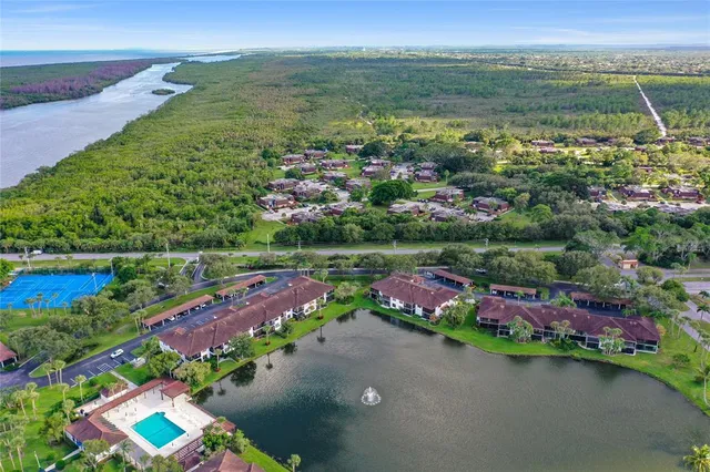 an aerial view of lake residential houses with outdoor space and lake view