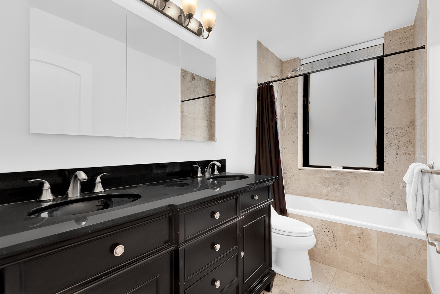 330 East 75th Street, Unit 4B Manhattan, NY 10021 - Photo 7 of 12 a bathroom with a granite countertop sink a toilet and bathtub