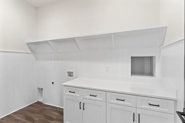 a view of storage and utility room with closet