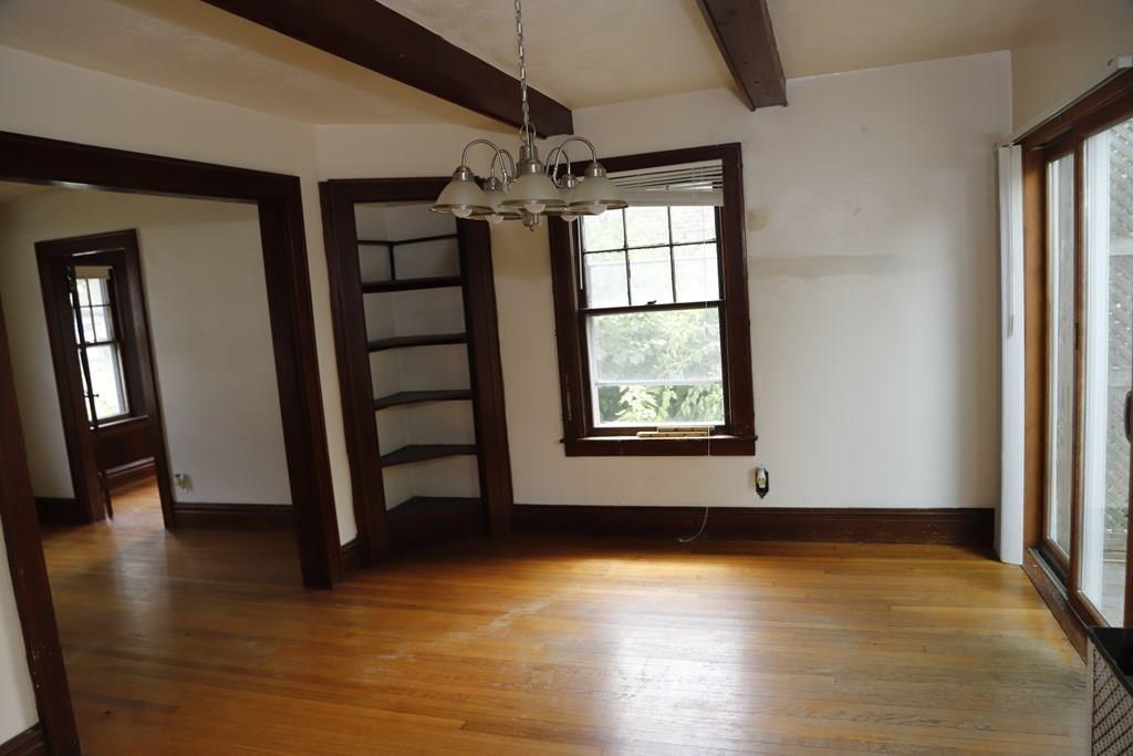 80 Farnsworth Street Springfield, MA 01107 - Photo 16 of 42 an empty room with wooden floor and windows
