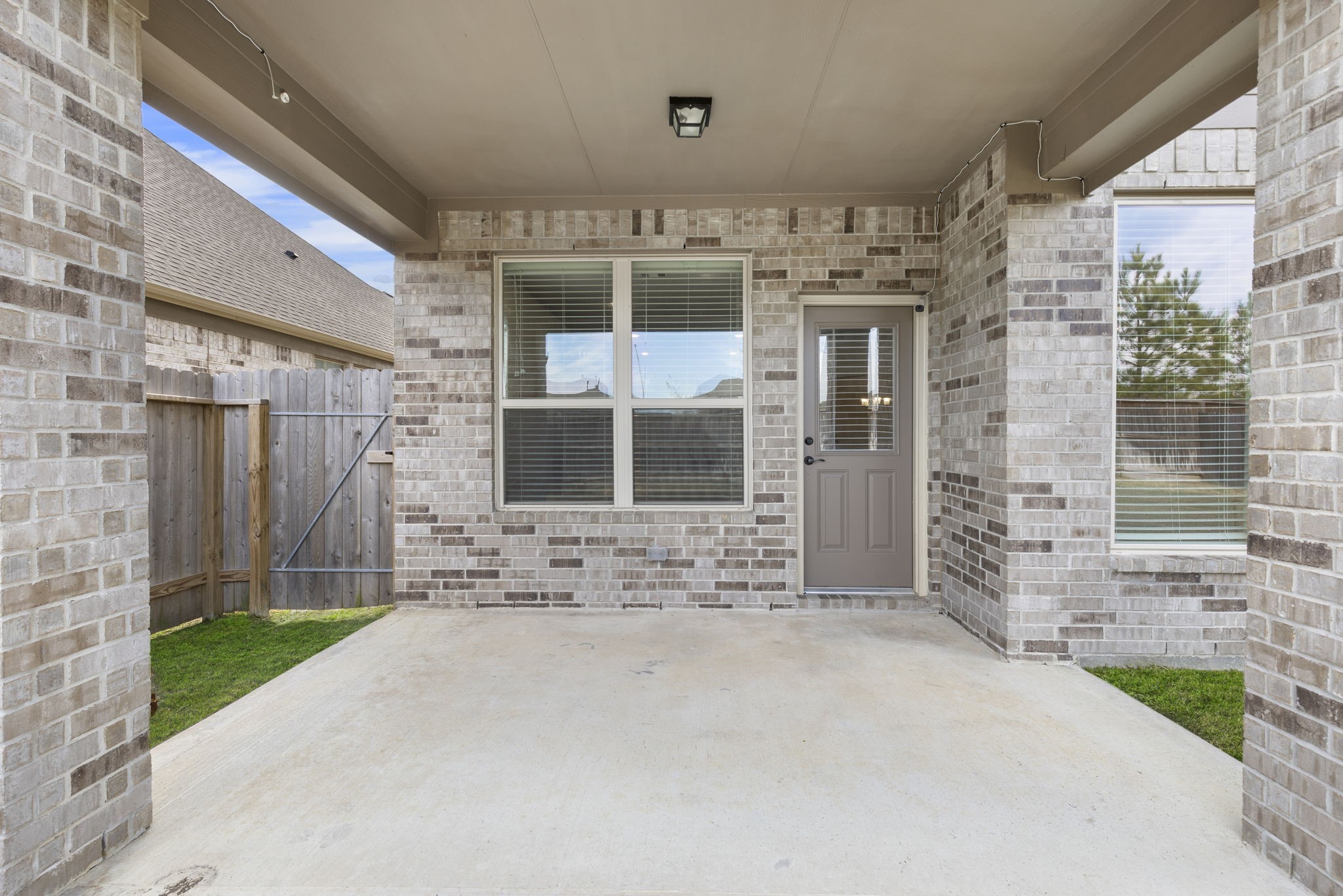 2819 Bradbury Hills Road Spring, TX 77373 - Photo 45 of 50 This charming covered patio offers a perfect retreat for relaxation and outdoor entertainment, seamlessly blending comfort and style.