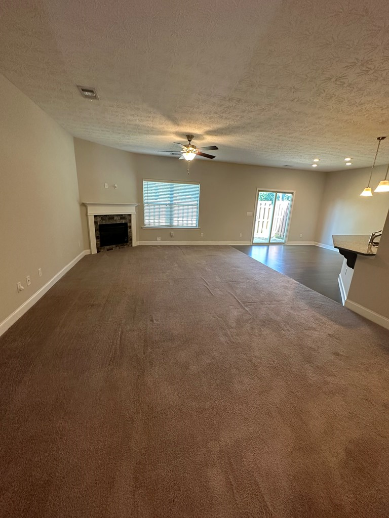 6008 Townes Way Columbus, GA 31909 - Photo 5 of 22 a view of empty room with windows and fireplace