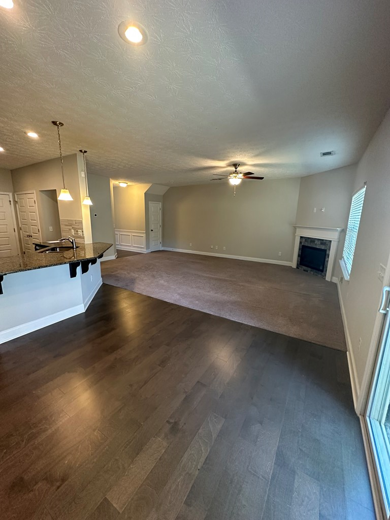 6008 Townes Way Columbus, GA 31909 - Photo 6 of 22 an empty room with wooden floor and windows