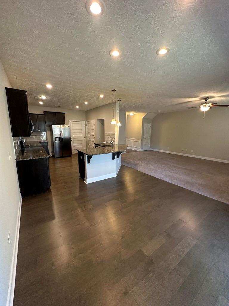 6008 Townes Way Columbus, GA 31909 - Photo 7 of 22 a view of a living room and kitchen with furniture