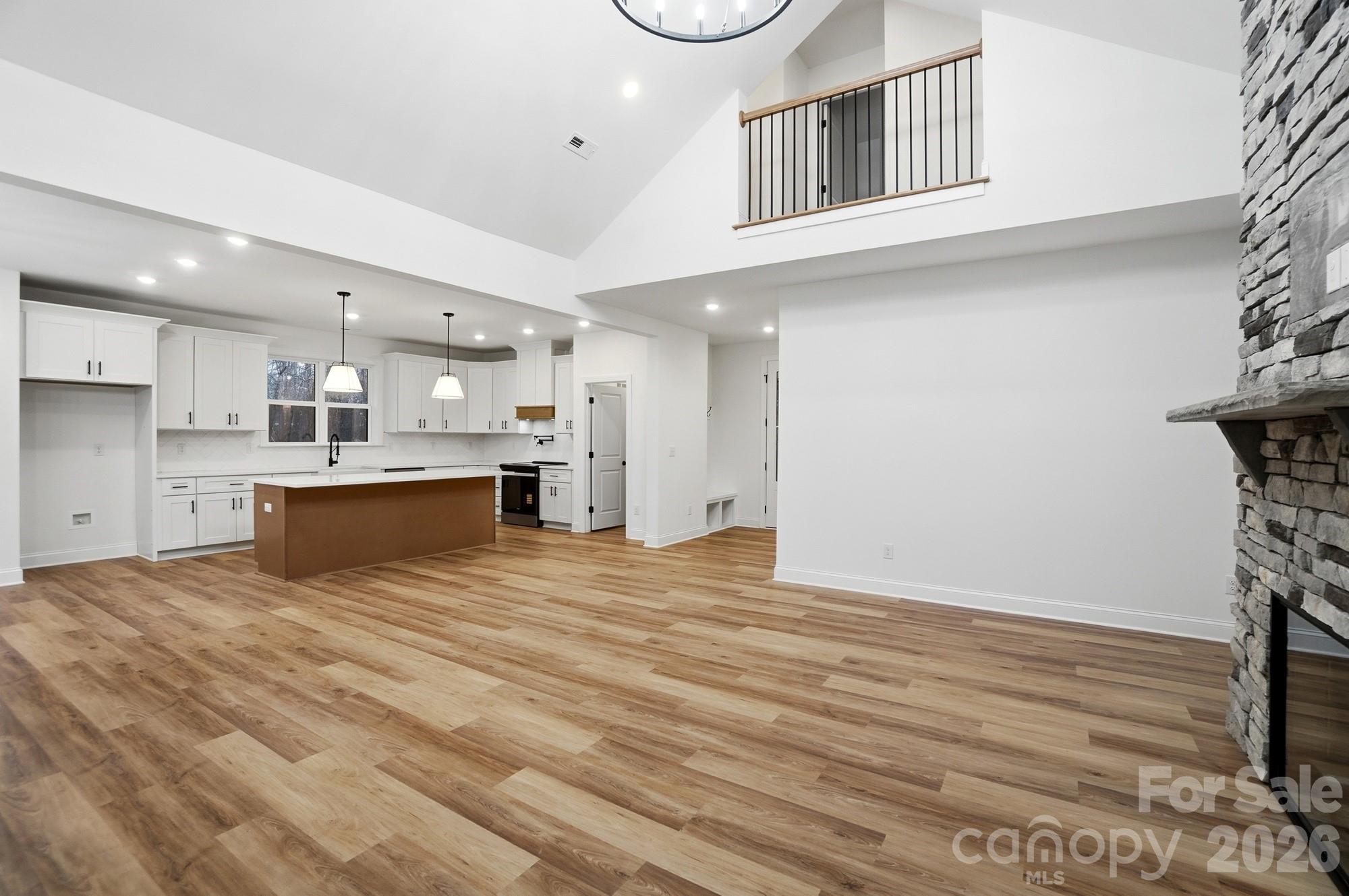 240 Hephzibah Church Road Crouse, NC 28033 - Photo 11 of 48 a view of kitchen with kitchen island white cabinets and stainless steel appliances