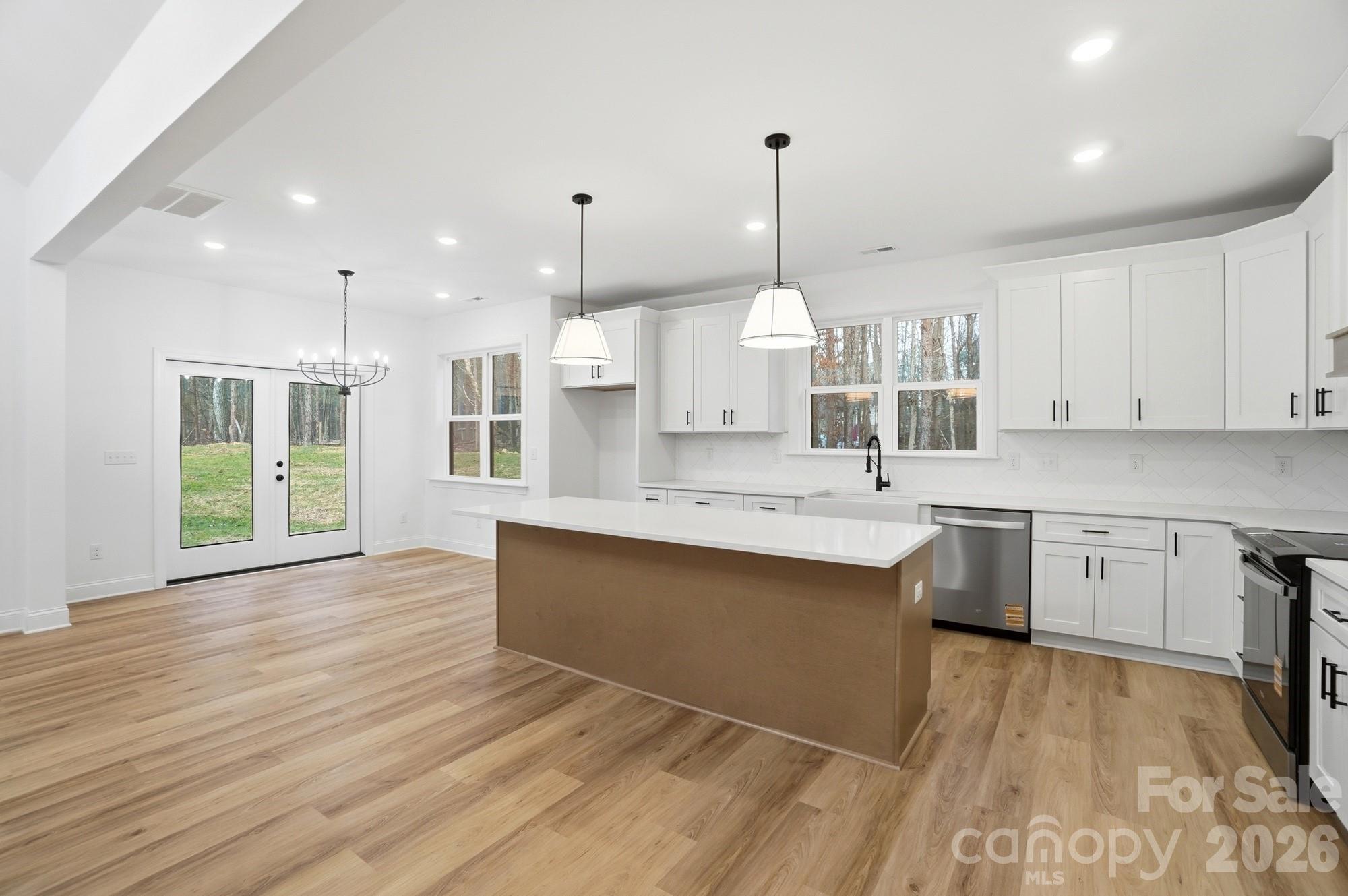 240 Hephzibah Church Road Crouse, NC 28033 - Photo 13 of 48 a large kitchen with kitchen island a sink stainless steel appliances and cabinets