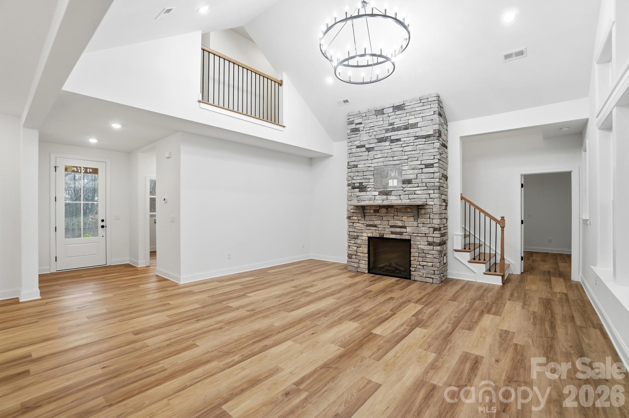 240 Hephzibah Church Road Crouse, NC 28033 - Photo 16 of 48 a view of a livingroom with wooden floor and a fireplace