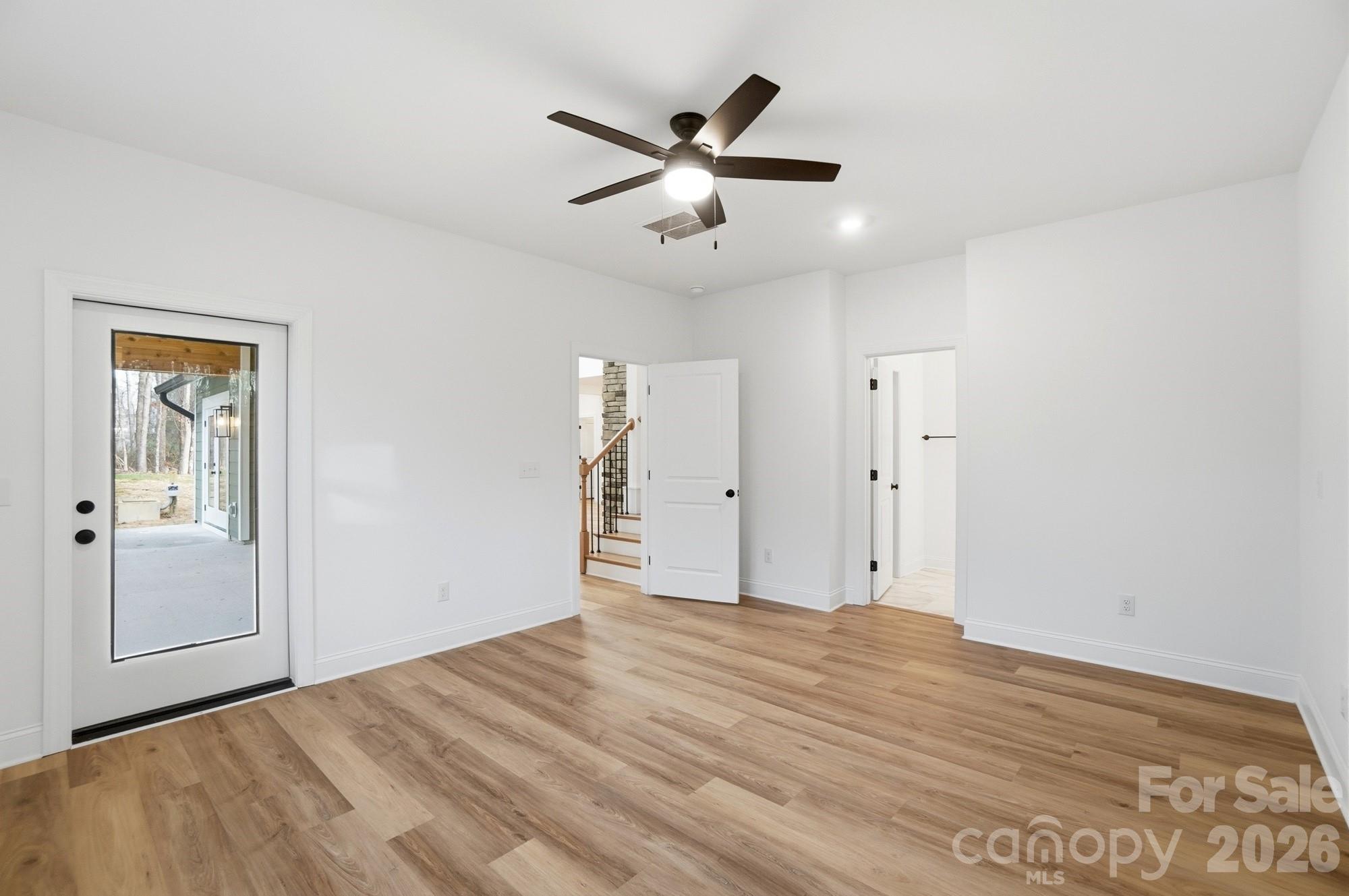 240 Hephzibah Church Road Crouse, NC 28033 - Photo 25 of 48 a view of an empty room with cabinet and a ceiling fan