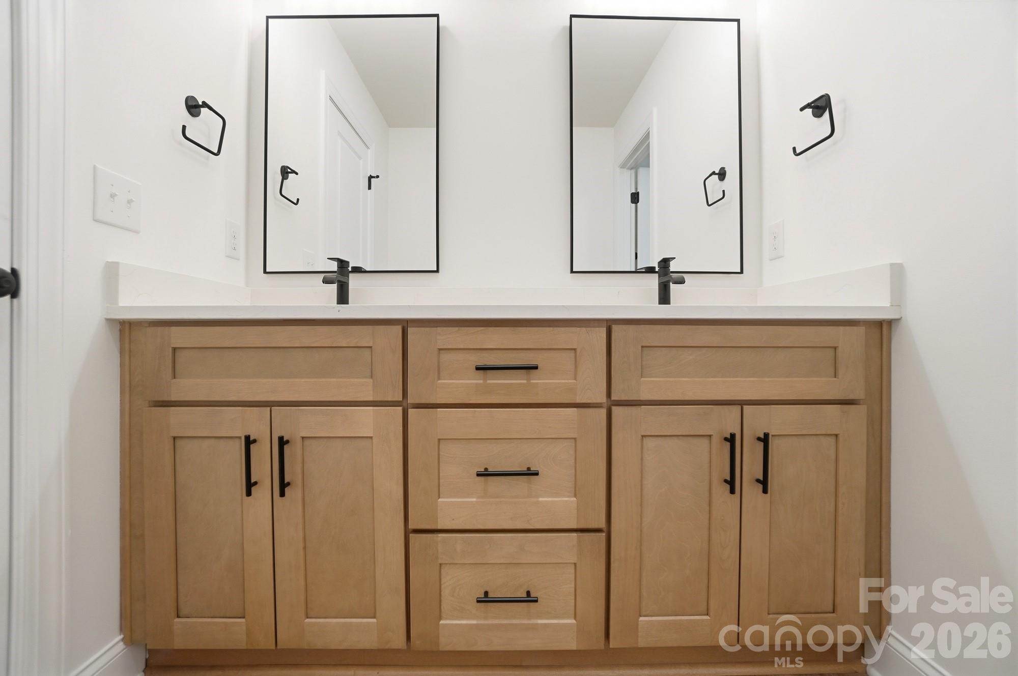 240 Hephzibah Church Road Crouse, NC 28033 - Photo 29 of 48 a bathroom with a double vanity sink and mirror