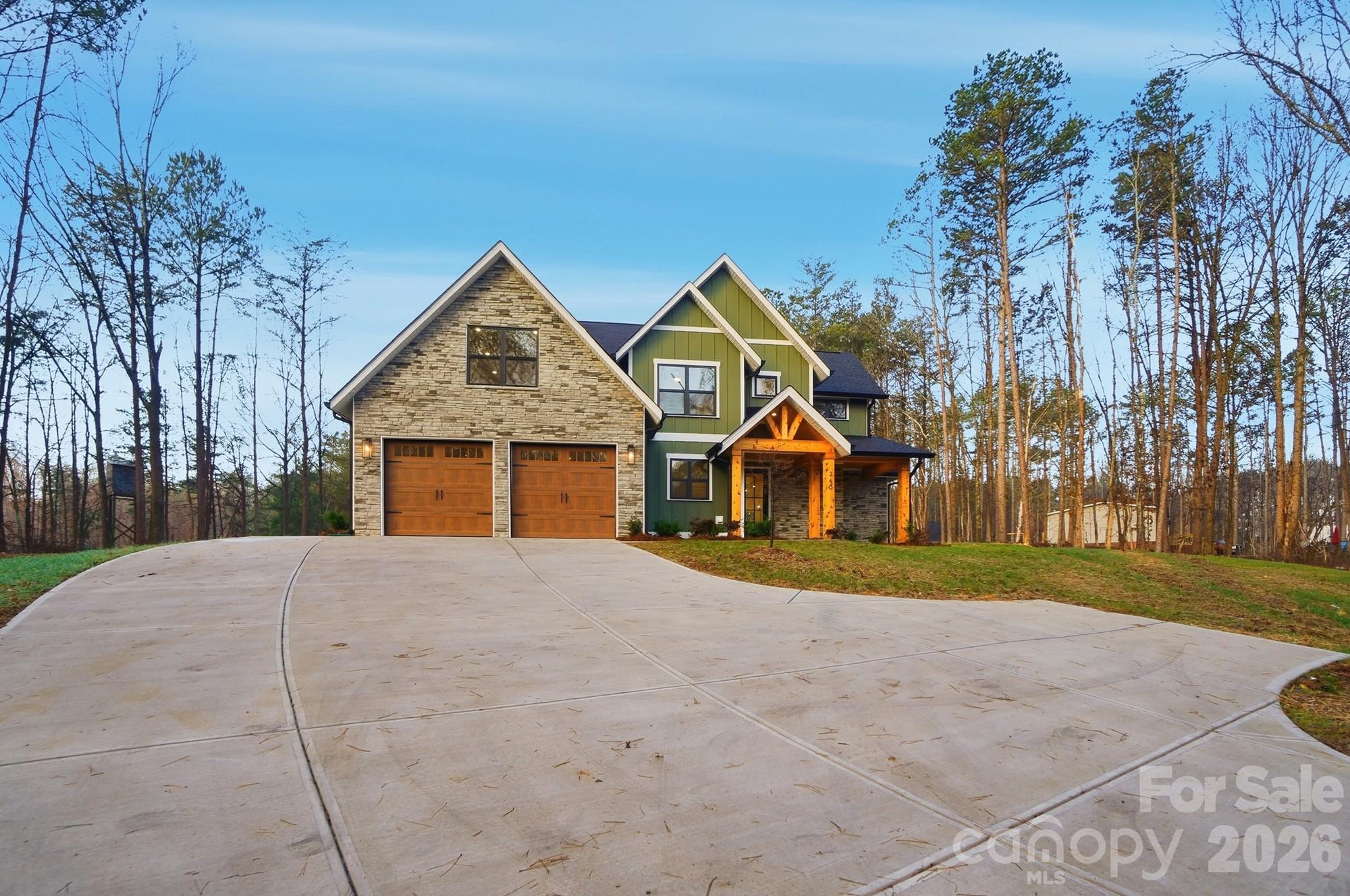 240 Hephzibah Church Road Crouse, NC 28033 - Photo 3 of 48 a front view of a house with a yard and garage