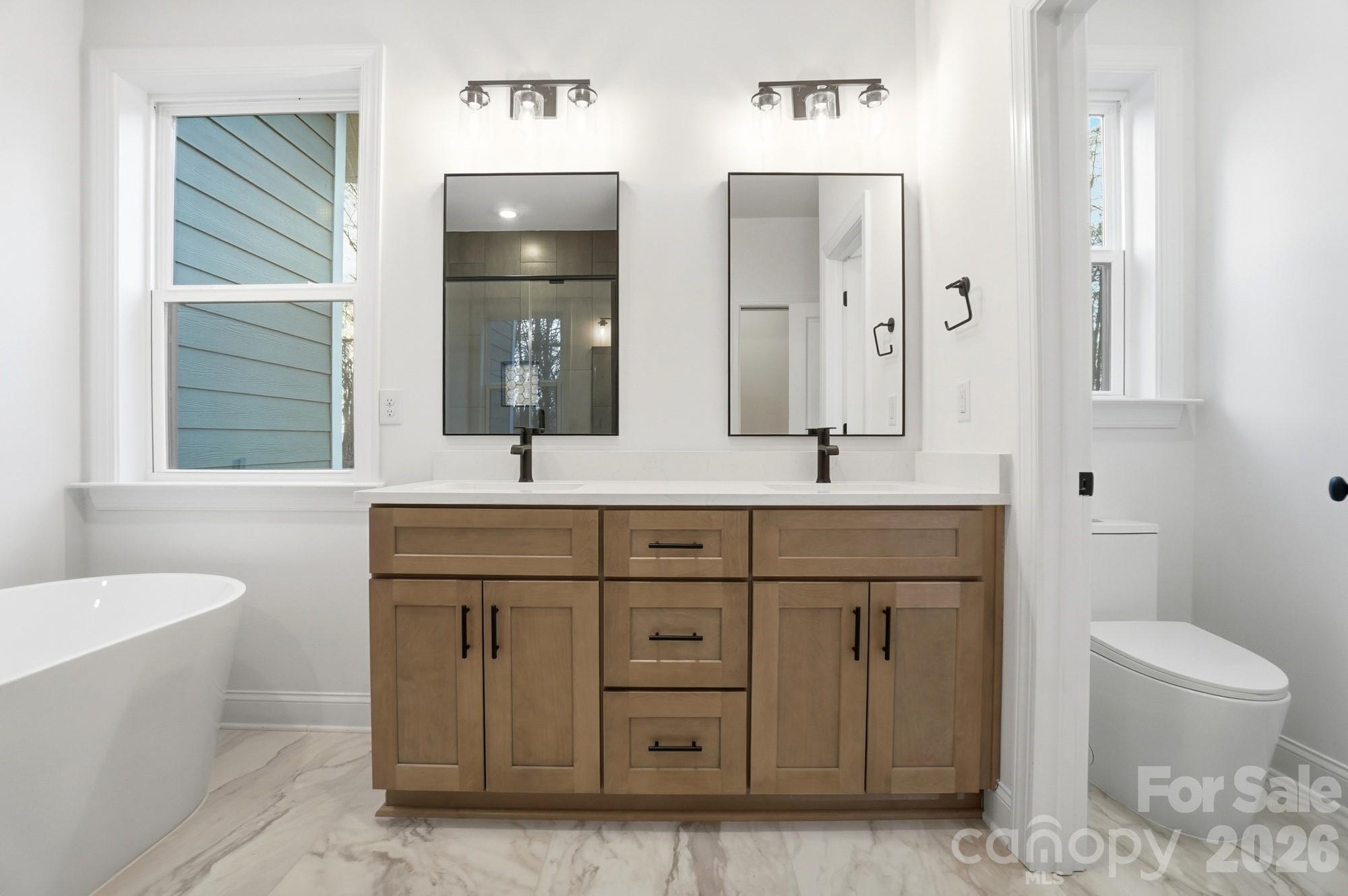 240 Hephzibah Church Road Crouse, NC 28033 - Photo 31 of 48 a bathroom with a granite countertop sink a toilet and a bathtub