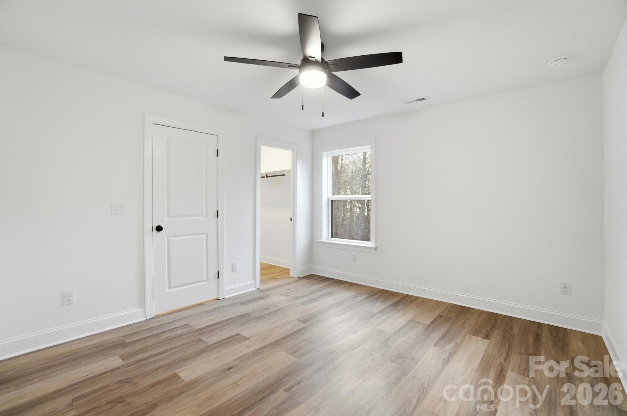 240 Hephzibah Church Road Crouse, NC 28033 - Photo 35 of 48 wooden floor in an empty room with a window