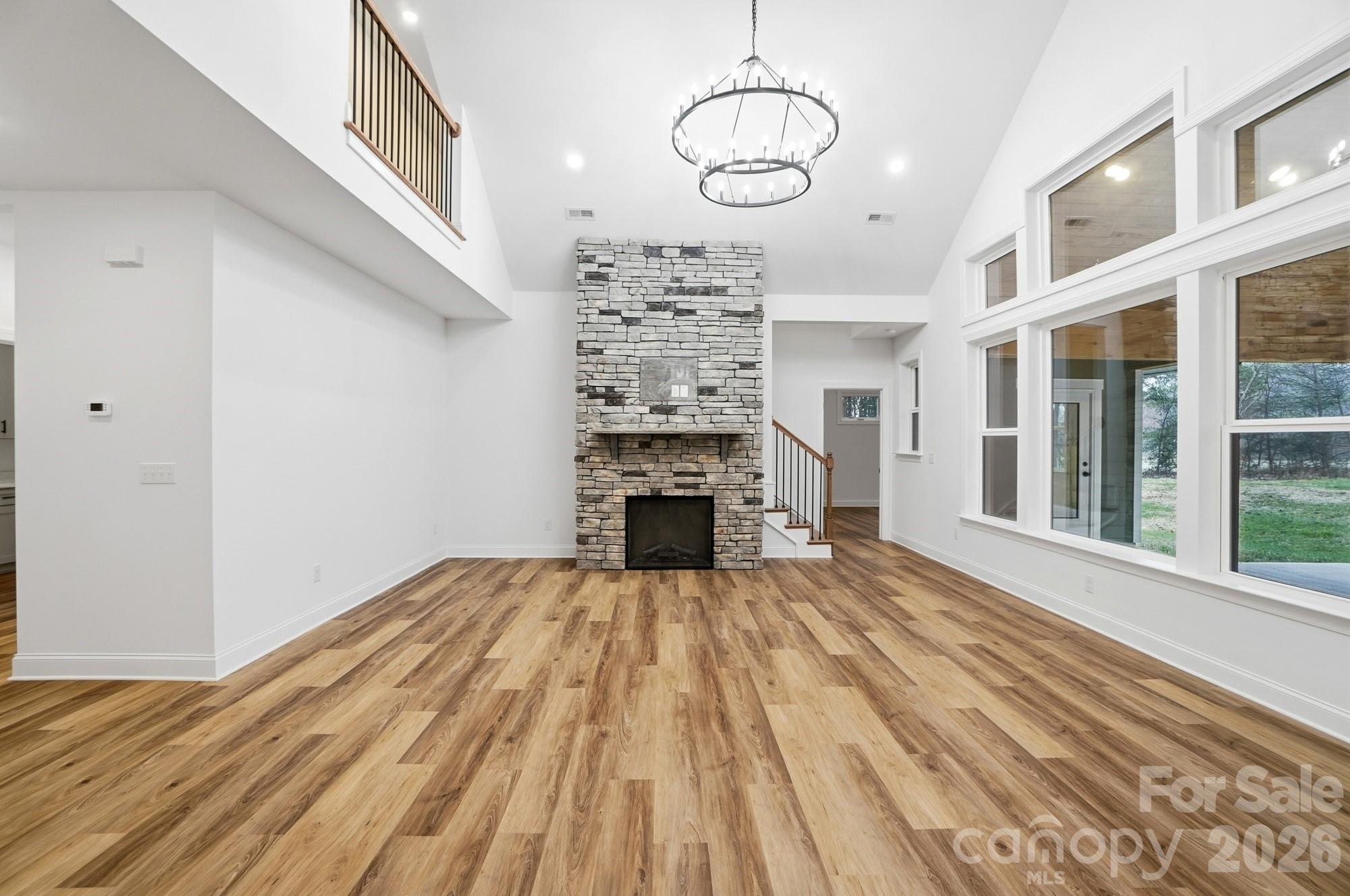 240 Hephzibah Church Road Crouse, NC 28033 - Photo 7 of 48 a view of a livingroom with wooden floor fireplace and window