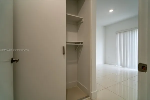 a view of an empty room with a window