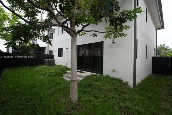 a backyard of a house with lots of green space