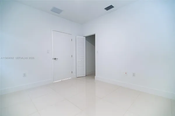 a view of an empty room and window