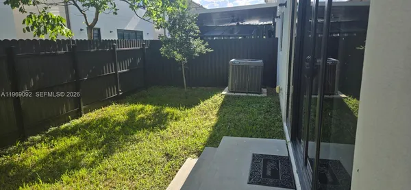 a view of backyard with tub