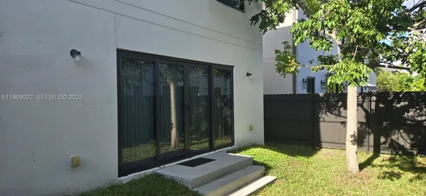 a backyard of a house with lots of green space