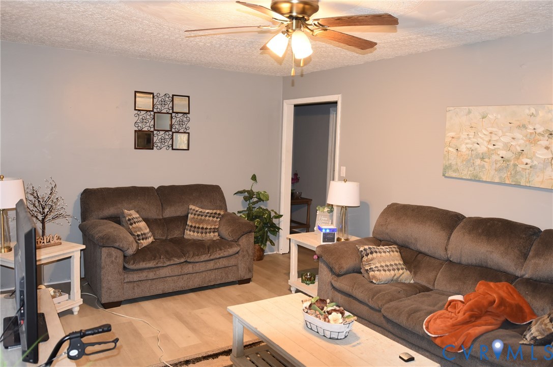 642 Star Street Pounding Mill, VA 24637 - Photo 7 of 20 Living area featuring wood-finish flooring, neutra