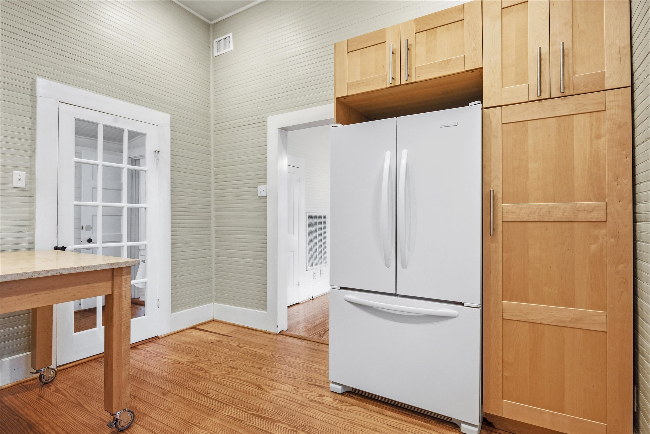 1613 Drake Avenue Austin, TX 78704 - Photo 10 of 27 Natural wood cabinetry providing extensive storage