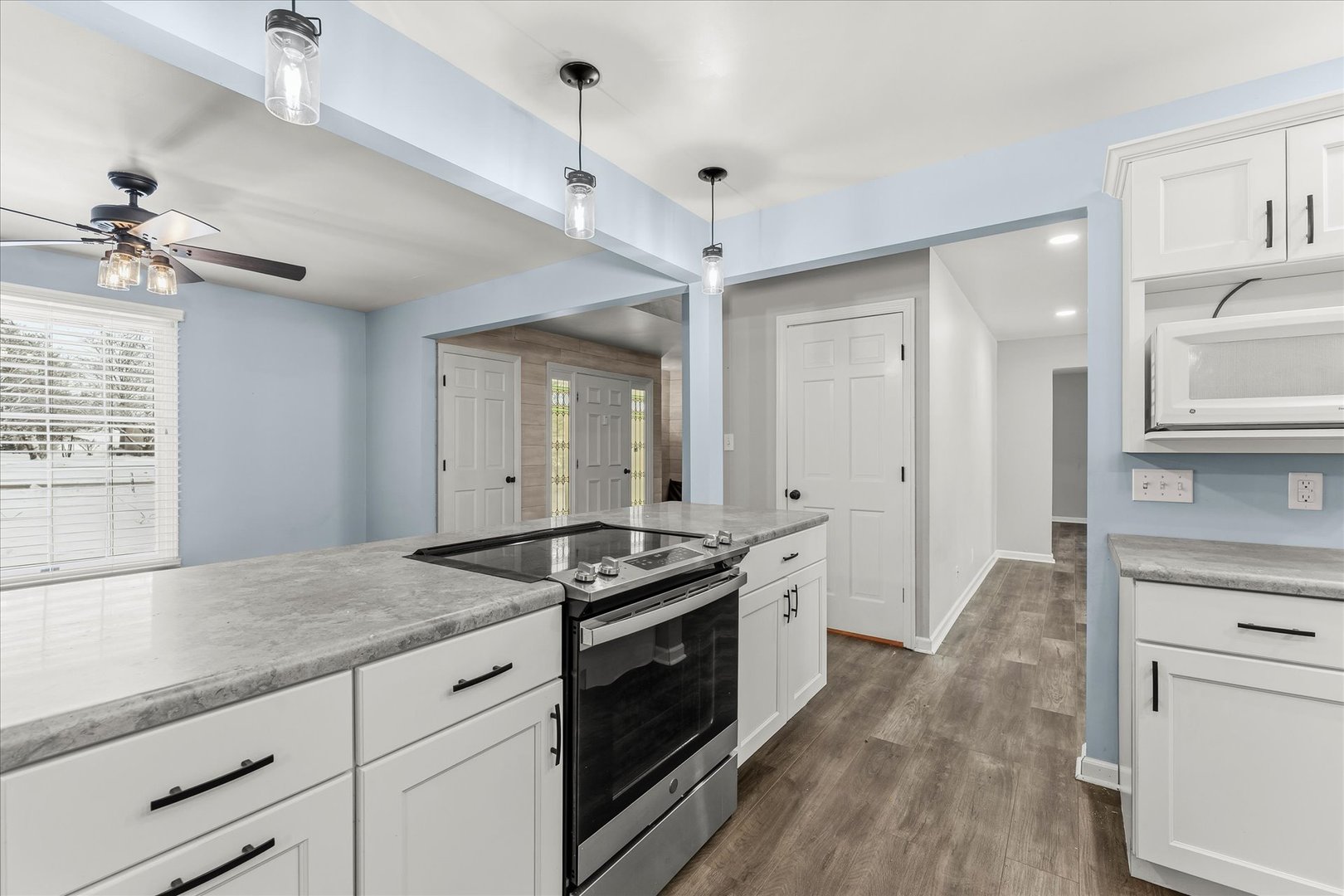 142 Lake Road Seymour, IL 61875 - Photo 14 of 49 a kitchen with granite countertop a stove a sink and a refrigerator