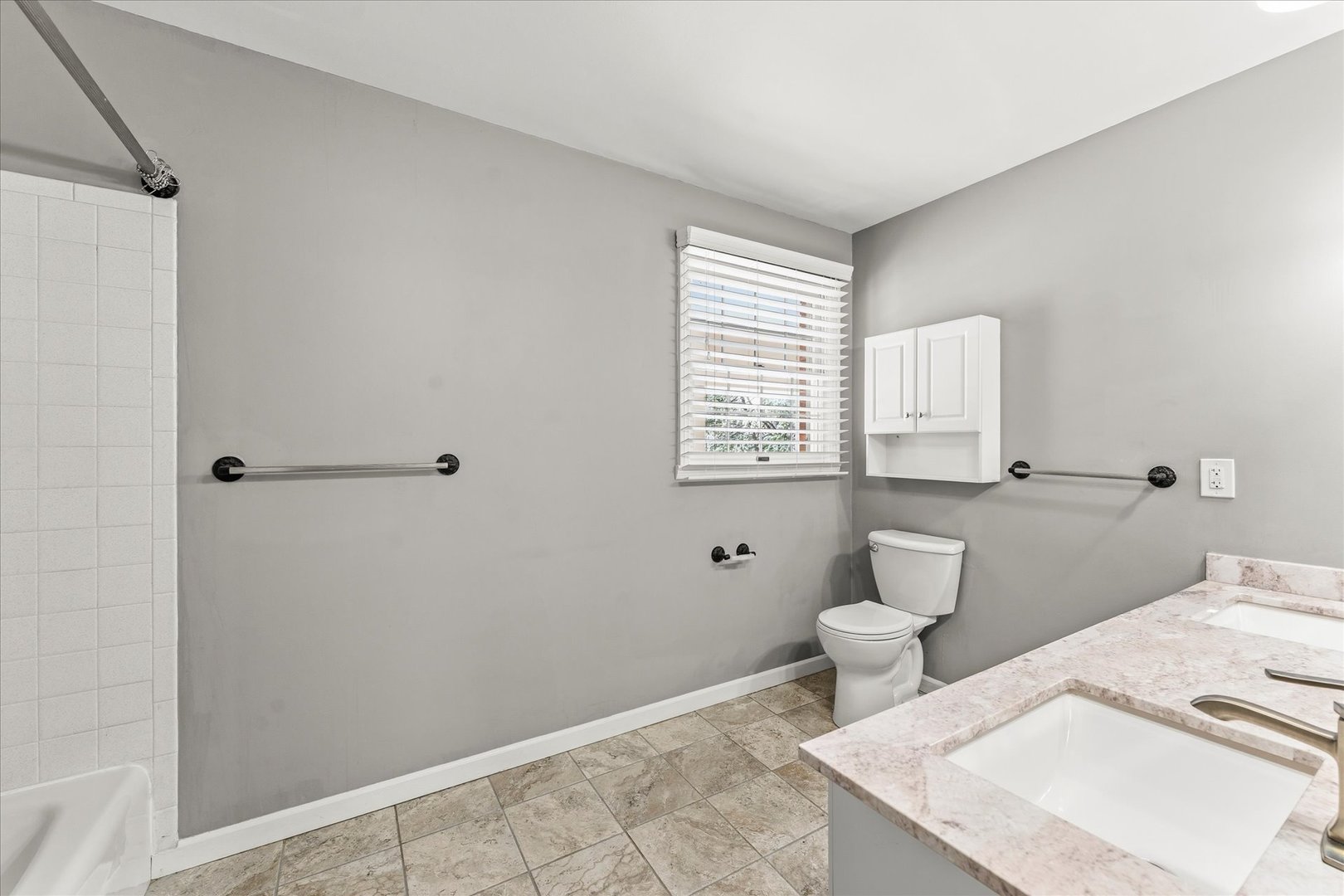 142 Lake Road Seymour, IL 61875 - Photo 22 of 49 a bathroom with a toilet a sink and a window