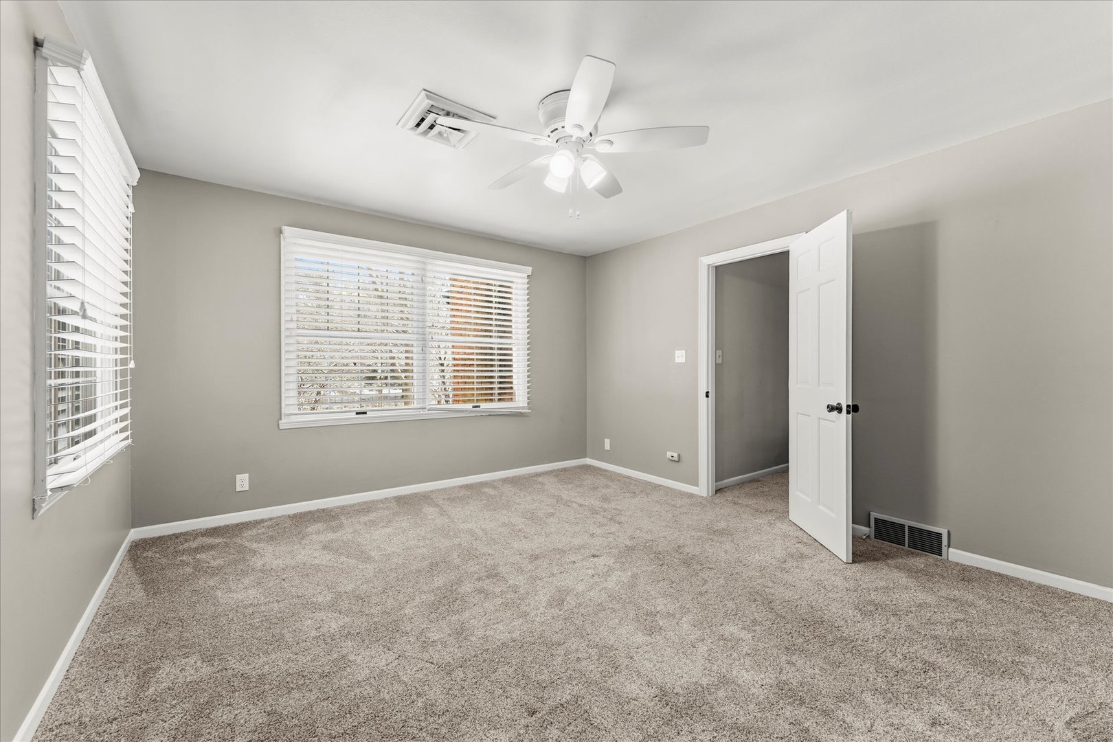 142 Lake Road Seymour, IL 61875 - Photo 27 of 49 an empty room with windows and fan