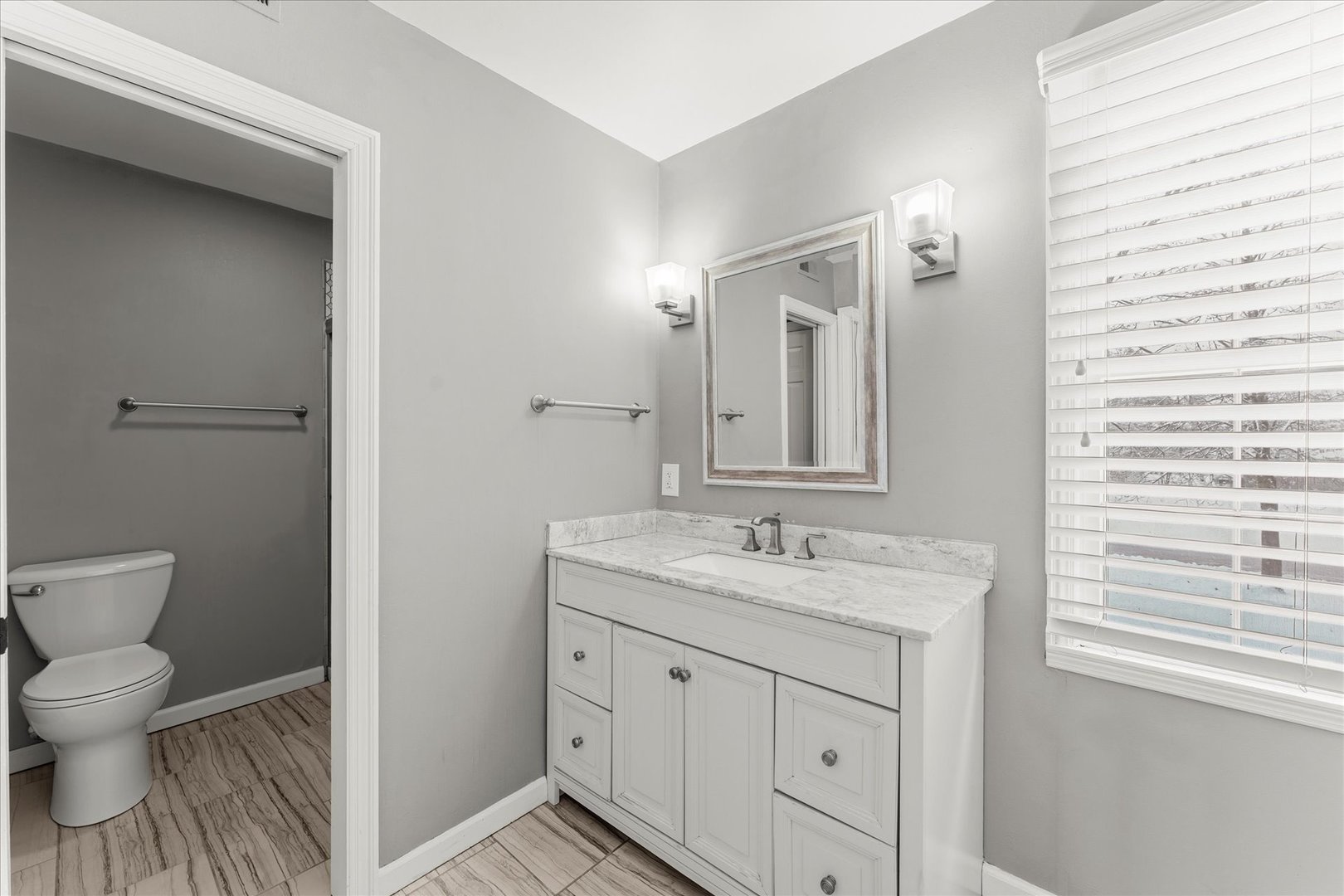 142 Lake Road Seymour, IL 61875 - Photo 28 of 49 a spacious bathroom with a toilet sink and a mirror