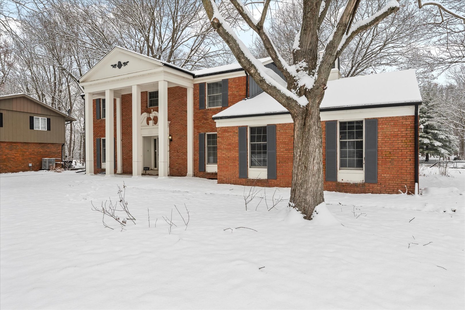 142 Lake Road Seymour, IL 61875 - Photo 42 of 49 a front view of a house with a yard covered in snow