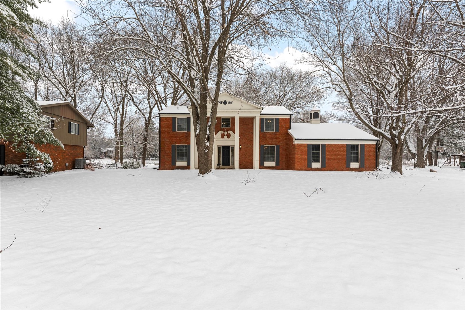 142 Lake Road Seymour, IL 61875 - Photo 44 of 49 a front view of house with a yard covered in snow