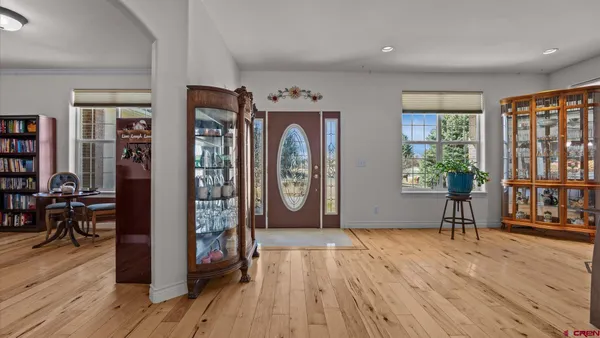 a view of entryway with wooden floor