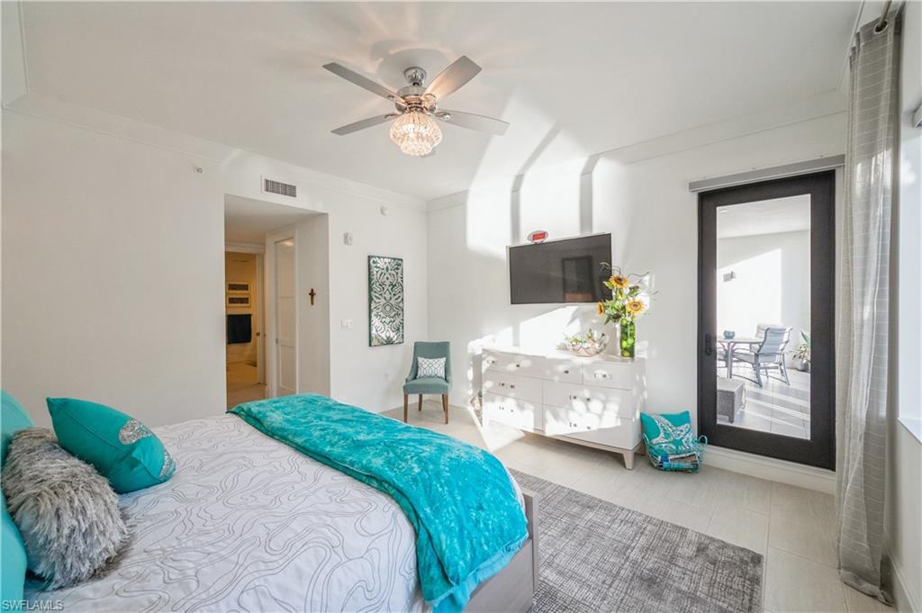 1135 3rd Avenue South, Unit 304 Naples, FL 34102 - Photo 20 of 35 Tiled bedroom with ceiling fan