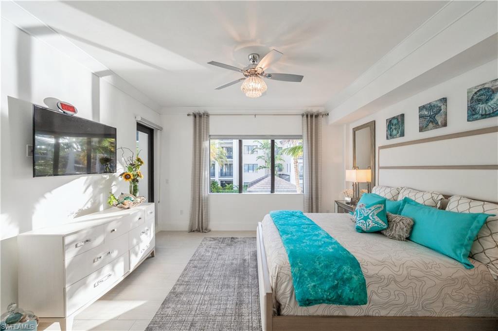1135 3rd Avenue South, Unit 304 Naples, FL 34102 - Photo 21 of 35 Bedroom featuring ceiling fan and crown molding