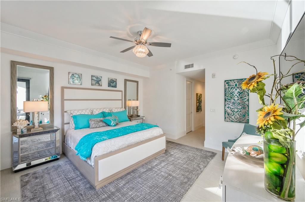 1135 3rd Avenue South, Unit 304 Naples, FL 34102 - Photo 22 of 35 Bedroom with ceiling fan and ornamental molding