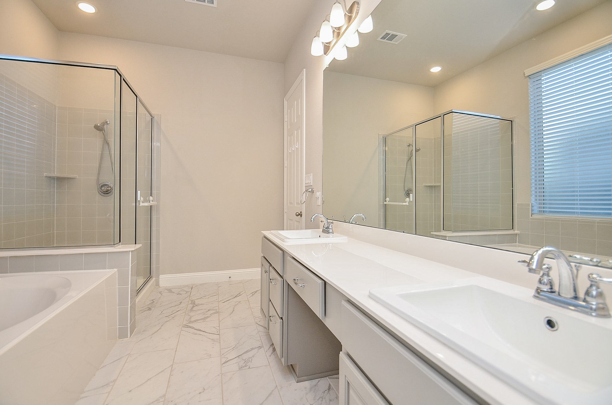 338 Summer Landing Court Rosenberg, TX 77469 - Photo 12 of 50 a bathroom with a tub sink shower and mirror