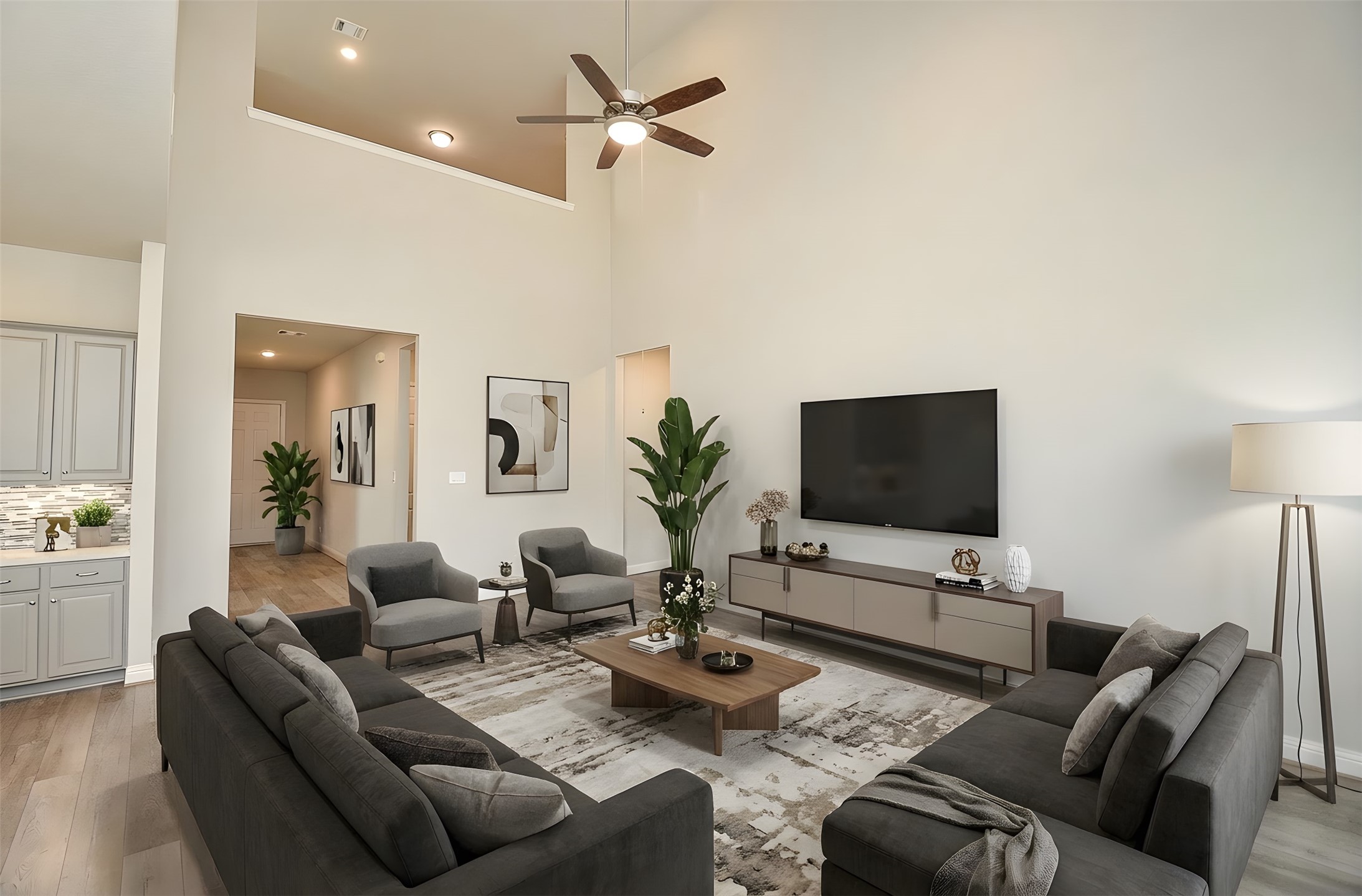 338 Summer Landing Court Rosenberg, TX 77469 - Photo 23 of 50 a living room with furniture a chandelier and a flat screen tv