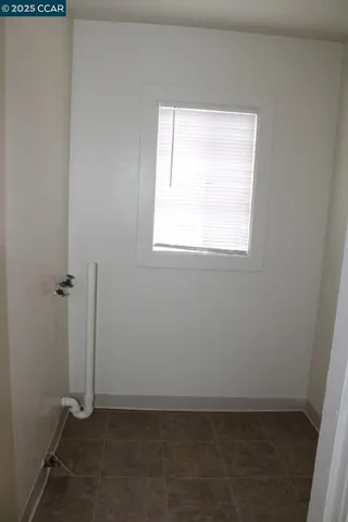 a view of a hallway with entryway door