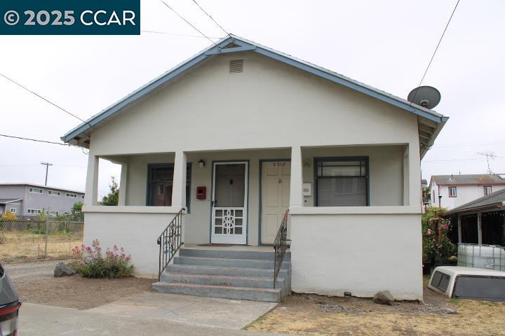 5918 Alameda Avenue, Unit 5918 Richmond, CA 94804 - Photo 16 of 16 a front view of a house with a garage