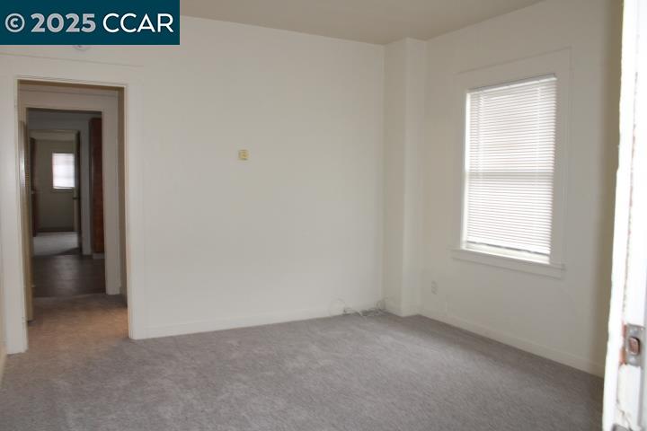 5918 Alameda Avenue, Unit 5918 Richmond, CA 94804 - Photo 3 of 16 a view of an empty room with a window