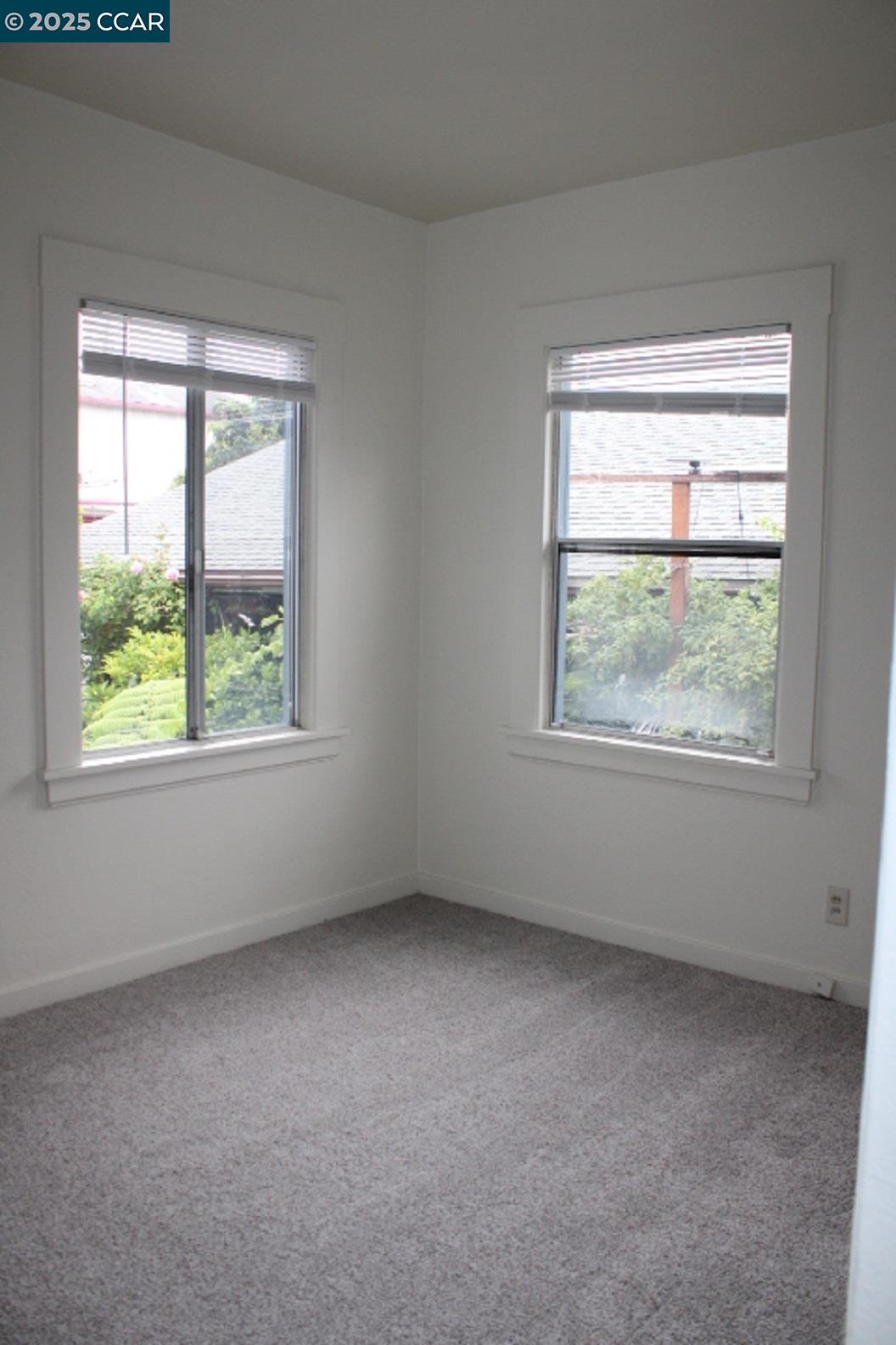 5918 Alameda Avenue, Unit 5918 Richmond, CA 94804 - Photo 10 of 16 an empty room with a window
